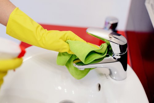 Professional oven cleaner in Richmond removing grease from an oven interior