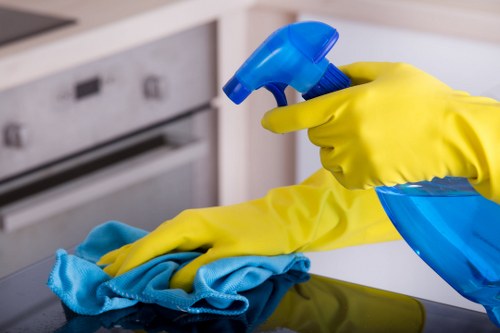 Kitchen surfaces being cleaned during domestic cleaning in Richmond